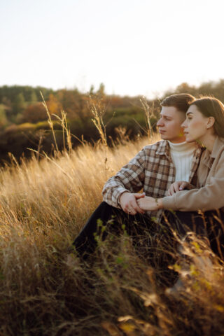 Happy couple in love walking in the park on a autumn day. Relaxation, youth, love, lifestyle concept.