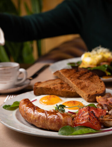 Full English breakfast - fried egg, baked beans, bacon, sausages